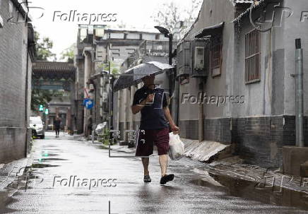 Daily life amid rain in Beijing