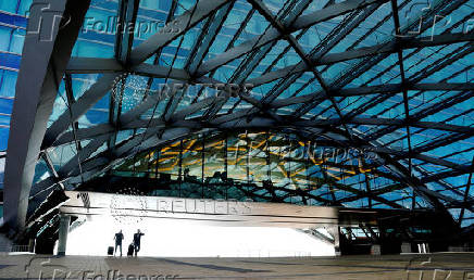 FILE PHOTO: Travelers leave the airport hotel at Denver International Airport in Denver