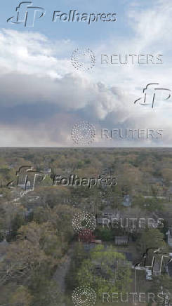 Smoke rises from a wildfire in Pine Beach