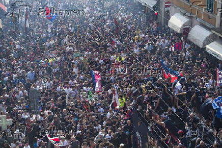 Players of Bologna FC and fans celebrate in Bologna