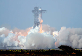 SpaceX's next-generation Starship spacecraft atop its Super Heavy booster is prepared for launch