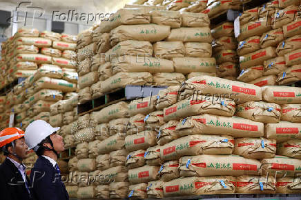 Japan's Agriculture, Forestry and Fisheries Minister Koizumi inspects a warehouse storing stockpiled rice in Kanagawa