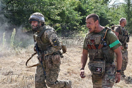Ukrainian service members attend a military drill near a frontline, in Zaporizhzhia region