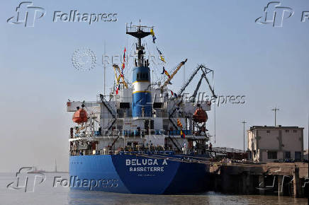 A Cargo ship loaded with sugar for export to Libya stands at the Deendayal Port in Kandla