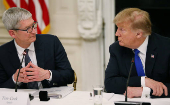 FILE PHOTO: Apple CEO Cook and U.S. President Trump participate in American Workforce Policy Advisory Board meeting at the White House in Washington