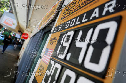 FILE PHOTO: Exchange rates of the Mexican peso against the U.S dollar in Mexico City