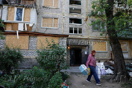 Apartment building damaged during Russian drone and missile strikes, in Kyiv