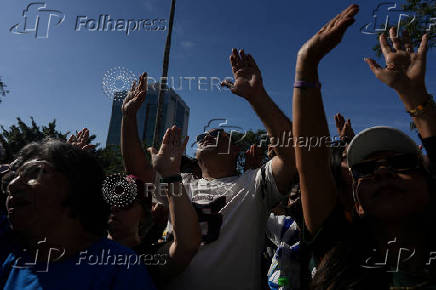 Brazilians attend an evangelical march to celebrate Corpus Christi in Sao Paulo