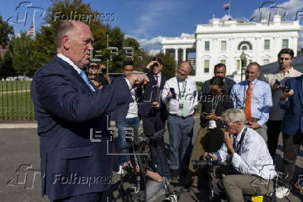 US Border Czar Tom Homan talks with news media outside the West Wing