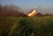 Ukrainian servicemen fire a Grad MLRS towards Russian troops in Donetsk region