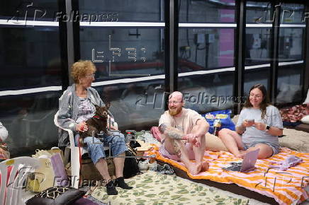 People shelter at Tel Aviv Light Rail Station amid ongoing Iranian ballistic missile threat