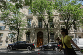 A pedestrian walks past a building where Jeffrey Epstein used to live,  in Manhattan on the Upper East Side in New York City