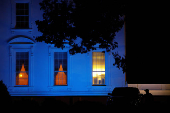 FILE PHOTO: The North Portico of the White House is illuminated in blue for Autism Awareness Day, in Washington