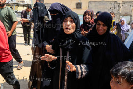 Mourners react during the funeral of Palestinians killed in what the Gaza Health Ministry said were Israeli airstrikes, in Khan Younis