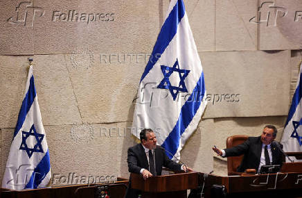 Israeli Knesset member Ayman Odeh speaks at the plenum in the Knesset, Israel's parliament, ahead of a vote over his possible expulsion from parliament, in Jerusalem