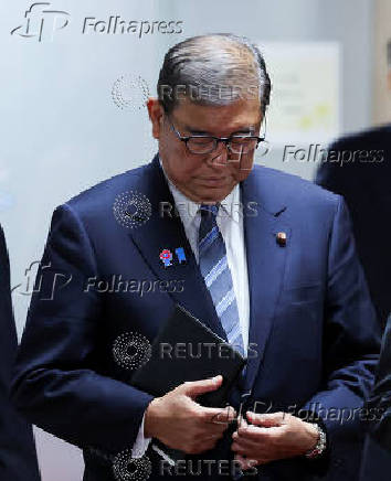 Japan's Prime Minister Ishiba speaks to media after meeting with the party's executives at the LDP headquarters in Tokyo