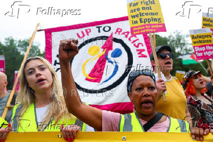 Anti-racism protesters attend a counter protest, on the day of an anti-immigration demonstrations outside the Bell Hotel in Epping