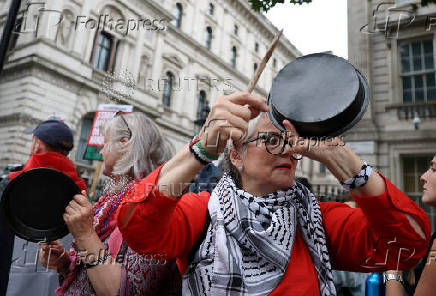 Pro-Palestinian demonstrators gather outside Downing Street, in London