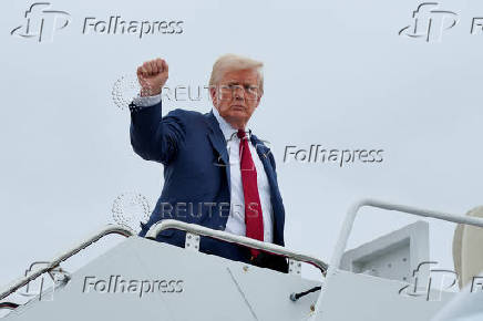 U.S. President Donald Trump boards Air Force One as he departs for New Jersey