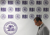Reserve Bank of India (RBI) Governor Sanjay Malhotra arrives at a press conference in Mumbai