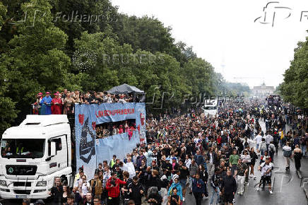 Revellers attend the 'Rave The Planet' techno parade, in Berlin