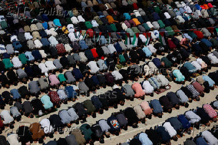 People pray on the day of the funerals of Sayfollah Kamel Musallet and Mohammad Al-Shalabi near Ramallah