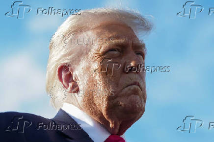 U.S. President Donald Trump speaks to members of the media upon his arrival from Pennsylvania, at Joint Base Andrews