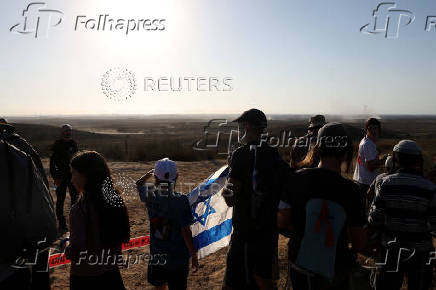 Israeli right wing activists take part in a rally organized by settlers groups to promote Israel's resettling in Gaza