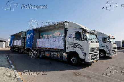 Trucks carrying aid is parked near the Kerem Shalom crossing between Israel and Gaza, before going into Gaza, on the Israeli side of the Israel-Gaza border