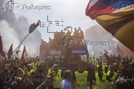 Players of Bologna FC and fans celebrate in Bologna