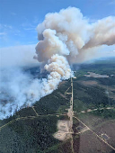Smoke rises from the Kiskatinaw River wildfire which has prompted evacuation orders in BC