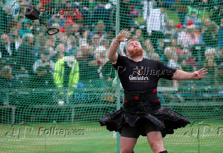 A competitor takes part in the Heavies event during the Braemar Royal Highland Gathering at the Princess Royal and Duke of Fife Memorial Park in Braemar, Scotland