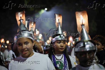 Demonstrators attend a march in defense of the living forest, territorial rights, and global climate responsibility during the U.N. Climate Change Conference (COP30) in Belem