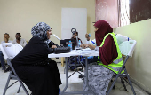 People have their biometrics recorded during voter registration, in Mogadishu