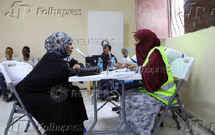 People have their biometrics recorded during voter registration, in Mogadishu