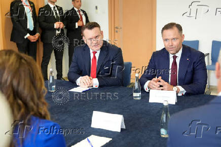 Poland's conservative presidential candidate Karol Nawrocki, meets with Homeland Security Secretary Kristi Noem, in Rzeszow