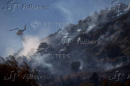 Wildfire burns in Koropi, near Athens