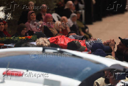 Mourners take part in the funeral of of Sayfollah Kamel Musallet, killed amid the Israel-Gaza conflict, near Ramallah