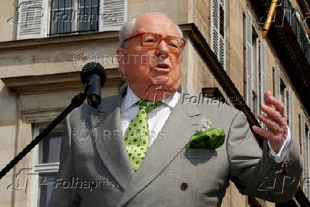 FILE PHOTO: French far-right National Front (FN) founder Jean-Marie Le Pen attends a May Day ceremony in front of the statue of Jeanne d'Arc (Joan of Arc) in Paris