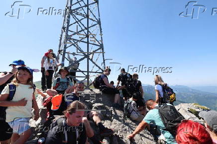 Hikers on the Giewont summit in the Tatra Mountains