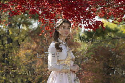 Tourists in Hanbok take selfies at Seoul’s Gyeongbokgung Palace