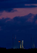 A United Launch Alliance Atlas V rocket stands on the pad with Amazon's Project Kuiper internet network satellites in Cape Canaveral