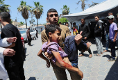 Palestinian casualties are brought into Al-Aqsa Martyrs Hospital, following an Israeli strike, in Deir al-Balah