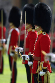Members of The Coldstream Guards stand inside the Quadrangle ahead of a ceremony at Windsor Castle