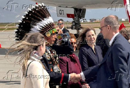 German Chancellor Merz is greeted by Tsuut'ina First Nation Minor Chief Crowchild in Calgary
