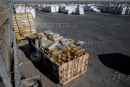 Humanitarian aid is waited to be transferred into Gaza from Israel, at the Gaza part of the Kerem Shalom crossing in the Gaza Strip