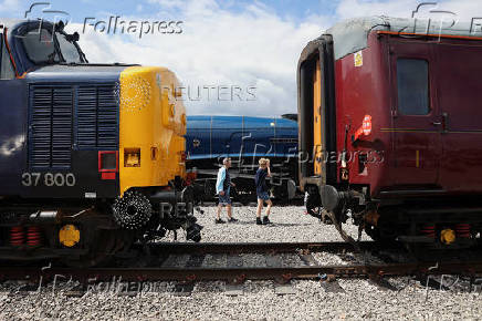 Visitors walk past the LNER A4 pacific locomotive 'Sir Nigel Gresley' at The Greatest Gathering, a railway festival marking 200 years of rail history, at Alstom?s Litchurch Lane factory in Derby