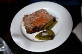 A slice of a pork terrine in a restaurant in Paris