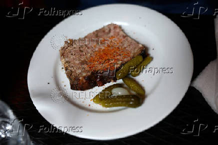 A slice of a pork terrine in a restaurant in Paris