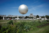 The return of a new Paris 2024 flame cauldron set on a balloon to the Tuileries Garden and the Paris skyline
